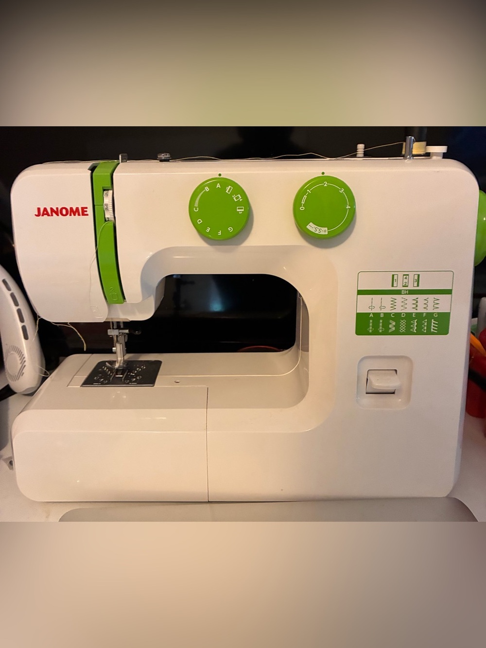 Janome White and Green Compact Sewing Machine. Fairly new. Only used twice.